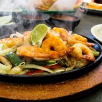 Shrimp Fajitas · Our famous fajitas are served with sauteed onions, bell peppers and tomatoes on a sizzling p...