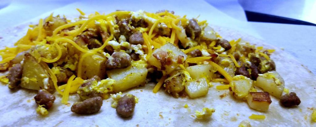 Chorizo & Egg Breakfast Burrito · Made with large tortilla, chorizo pork meat, eggs or potatoes, and cheese.