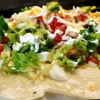 Veggie Burrito · Made with extra-large flour tortilla, Mexican rice, beans, cheese, avocados, sour cream, let...