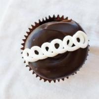 Chocolate Cream Cupcake · Chocolate cake filler with our signature buttercream, topped with our signature fudge frosti...