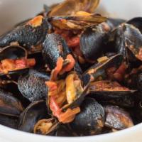 Mussels  · Steamed PEI mussels in smoky bacon marinara sauce.