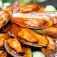 Mussels · Mejillones, cooked in our nayarit sauce.