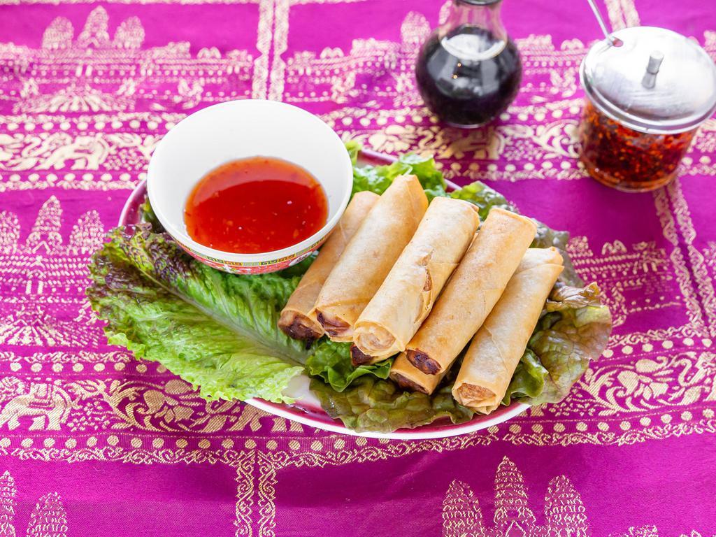  4. Fried Egg Rolls · 8 pieces. Prepared with minced pork, shredded cabbage, onions, and carrots, wrapped in a spring roll wrapper deep fried and served with a house sauce on a side dish.