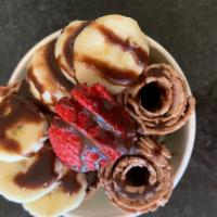 11. Jungle Love Ice Cream · Chocolate base. Strawberry, banana, and chocolate sauce (vegan and gluten free).