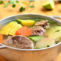 Beef soup (cocido de res) · Beef soup, rice, onion, cilantro, lemon, chile and tortillas.
