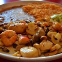 Camarones Rancheros · Grill Shrimp served with rice, beans, salad and corn tortillas.