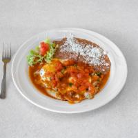 Huevos Rancheros · Eggs on top spicy tomato sauce. Served on a fried corn tortilla.