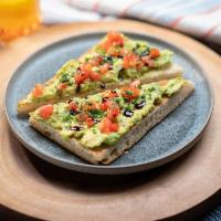 Avocado Toast · mashed avocado mixed with organic chives, organic heirloom tomato, balsamic dressing on hous...