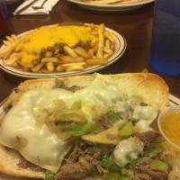 Philly Steak Sub Sandwich · Shredded steak with grilled onions, peppers, mushrooms and Swiss cheese.