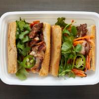 Pork Bahn Mi · Lemongrass Pork, Jalapenos, Pickled Vegetables, Fried Shallot Mayo, Cilantro
