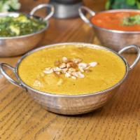 Korma · Coconut milk and cream-based curry sauce with nuts, raisins, and delicate spices.  