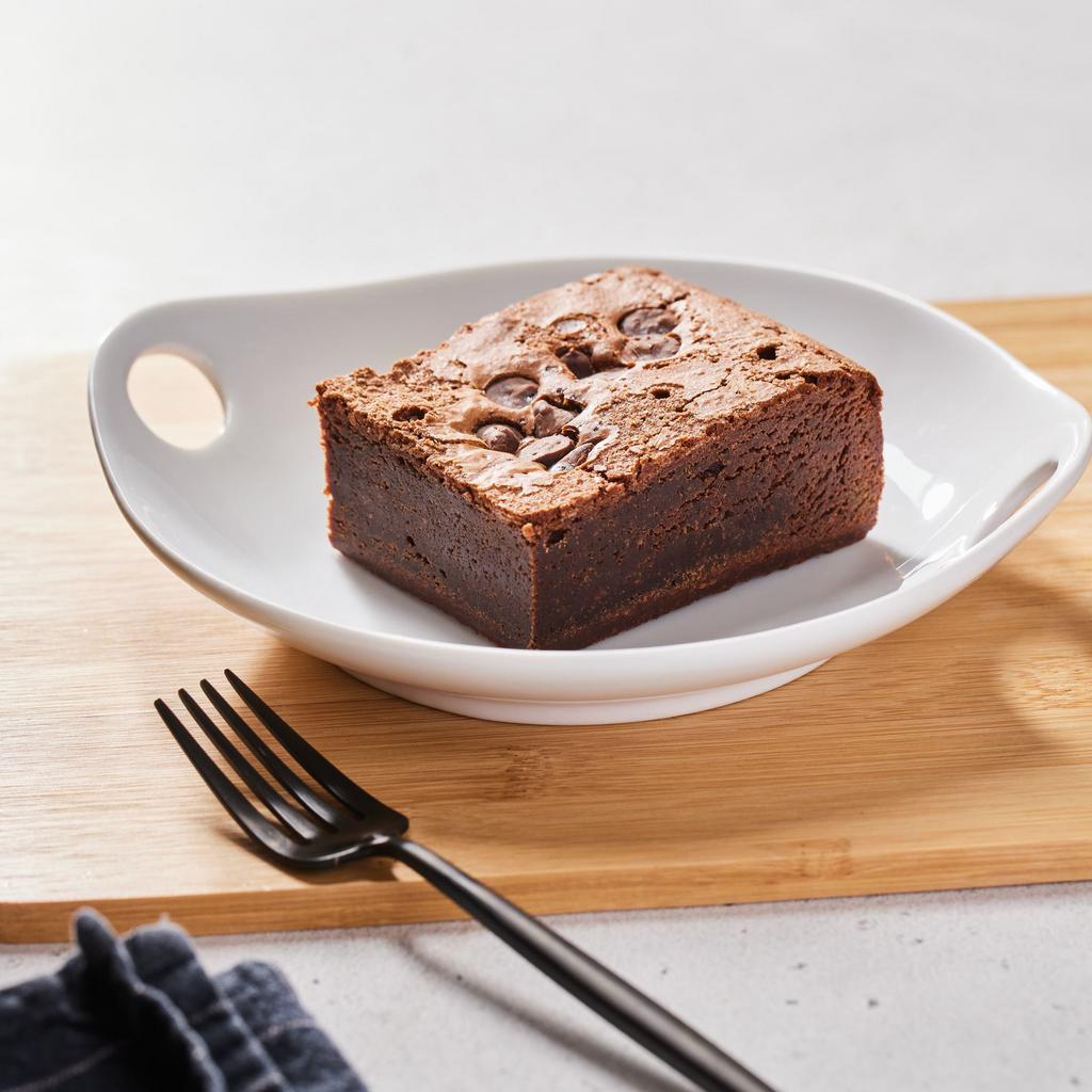 Fudgy Brownie by Homeroom · By Homeroom. A delicious, freshly baked, dark chocolate chunk brownie. Contains dairy and eggs. We cannot make substitutions.