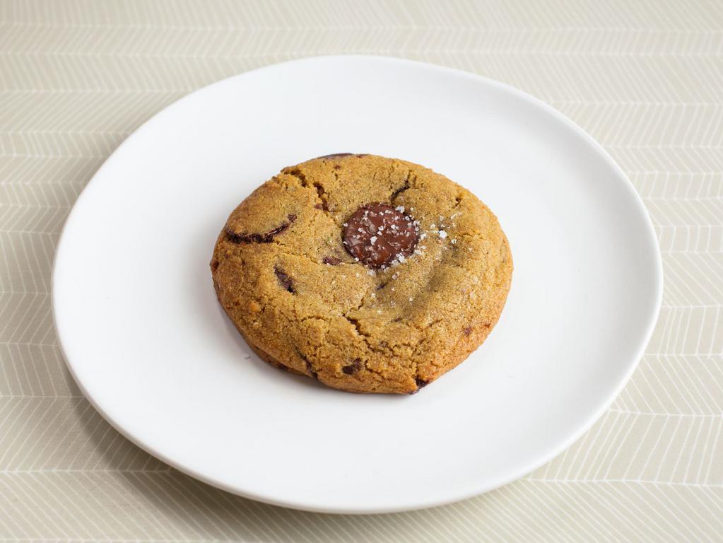 Brown Butter Chocolate Chip Cookie (V) by The Roost · By The Roost. Merchant Roots' original cookie masterpiece, made with cultured brown butter, muscovado sugar, and chocolate coins. Contains gluten, dairy, and eggs. We cannot make substitutions.
