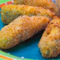 Jalapeno Poppers · 6 jalapeno poppers filled with cream cheese served with ranch.