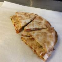 Quesadillas · Baked tortilla filled with melted cheddar and mozzarella cheese, onions, tomatoes, and green...