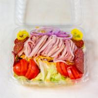 Chef's Salad · Mixed greens topped with thinly sliced turkey and ham, cheddar cheese, tomatoes, onions, and...
