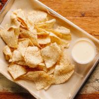Chips and Queso (V) · Corn tortilla chips with a side of queso blanco. Contains sesame, gluten, and dairy. We cann...