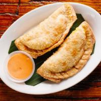 Chicken Empanadas · 2 pieces. Comes with croqueta sauce. Contains gluten, soy, nightshades, and eggs. We cannot ...