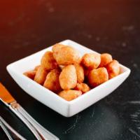 Cheese Curds (V) by Cheesie's · By Cheesie's. White cheddar cheese curds, beer battered and fried crispy. Contains gluten, p...