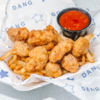Boneless GF Nuggets · 6 gluten-free nuggets with choice of sauce. Served with side of fries. Our nuggets are dredg...