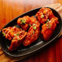 Sambal BBQ Wings · 6 wings. Chili paste, ketchup, star anise, cinnamon. This distinct spicy bbq sauce will sure...