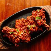 Sambal BBQ Thighs · 4 pieces. Boneless chicken thighs in a distinct spicy bbq sauce of chili paste, ketchup, sta...