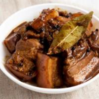 Adobo · Chicken or Pork riblets serves in a savory sauce.
