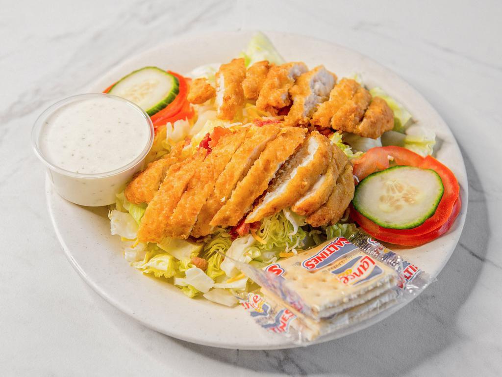 Crispy Chicken Salad · Sliced crispy chicken served over iceberg lettuce with shredded cheese, bacon crumbles, sliced tomatoes, and cucumber. Served with ranch dressing.