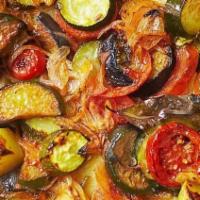 Briam · Fresh zucchini, eggplant, red & green peppers, onions, garlic and sliced potatoes in a heart...