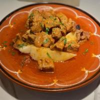 Afelia · Classic Cypriot pork casserole with potatoes, white wine, pureed tomatoes and seasoned with ...
