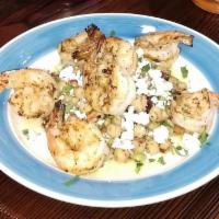 Garides Revsi · Grilled Tiger shrimp over a cool, fresh chickpea salad made with edamame, diced green & red ...