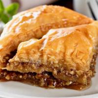 Baklava · Layers of phyllo dough sprinkled with nuts and cinnamon topped with honey syrup.