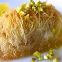 Kataifi · Shredded phyllo dough rolled with walnuts and cinnamon and soaked in a light honey syrup.