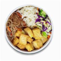 Doochi Bop (Vegetarian) · Korean style stir-fried tofu. Served with rice, cabbage mix, and noodle. *Vegan without lime...