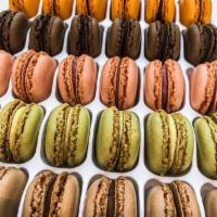 18 Variety Pack French Macarons · Your choice in flavor including; Caramel, lemon, vanilla, chocolate, pistachio, coffee, and ...