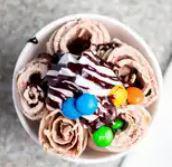 2. Monkey Business Ice Cream Roll · Vanilla base, nutella, banana, strawberry, m&ms and chocolate drizzle.