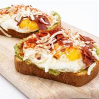 Egg-Me-On Avocado Toast · Two Slices of Brioche, Avocado Spread, Fried Egg, Mozzarella, Turkey Bacon