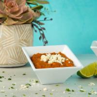 Chorizo Refried Beans Side · Refried beans, sautéed with chorizo and topped with queso fresco.