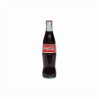 Mexican Coca Cola · This Mexican Coke is made with cane sugar while American Coke is made with high fructose cor...