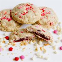 Cupid's Cookie · A chewy butter cookie stuffed with macadamia slices, candy coated chocolate, white chocolate...