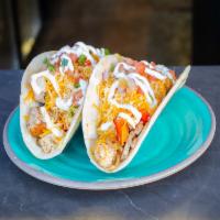 The Fajita Taco · Soft flour taco with choice of grilled steak, chicken or shrimp, rice, black bean, grilled o...