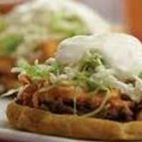 Sopes · Thick corn tortilla, pinto beans, onion, lettuce, sour cream, queso fresco, and choice of pr...