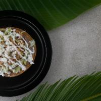 Tostadas · Toasted corn tortilla, beans, lettuce, cheese, sour cream, and choice of protein.