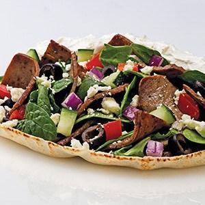 Gyros Combo · Seasoned strips of lamb and beef, spinach, cucumbers, tomatoes, onions, black olives, feta, tzatziki. Chips.