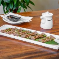 A5 Wagyu Tataki · Seared A-grade premium wagyu beef with special sauce steamed monkfish liver with special sau...