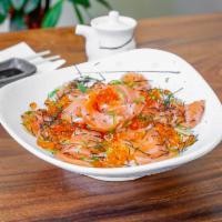 Salmon Ikura Don · Salmon and salmon roe over sushi rice with shredded nori and green onions.