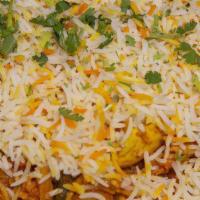 Vegetarian Biryani · Broccoli, cauliflower, peas, corn, carrots and rice baked with flavorful homemade spices. Ve...