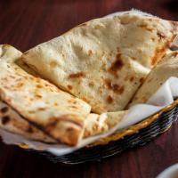 Naan Bread · A leavened and oven-baked flatbread.  Chef's recommendation.