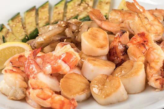 Ocean Treasure · Grilled cold water lobster tail with grilled Hokkaido scallops and colossal shrimp.