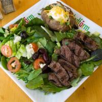 35. Grilled Steak Plate · Steak marinated and grilled to medium rare. Includes 2 sides.